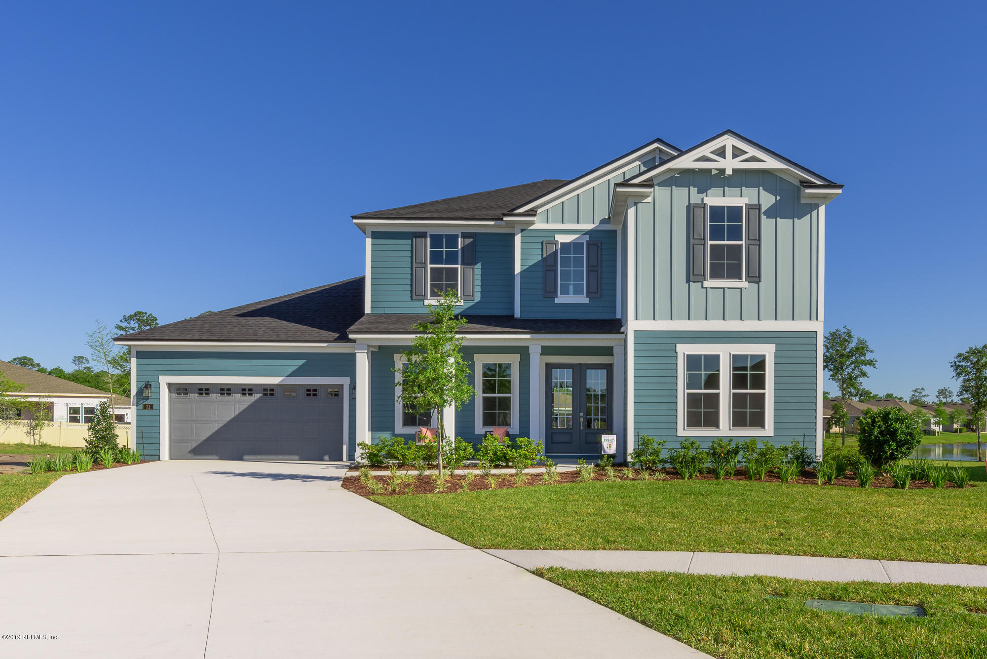 71 Lansing Court St. Augustine, FL 32092 - Photo 1 of 49 front view of a house with a yard