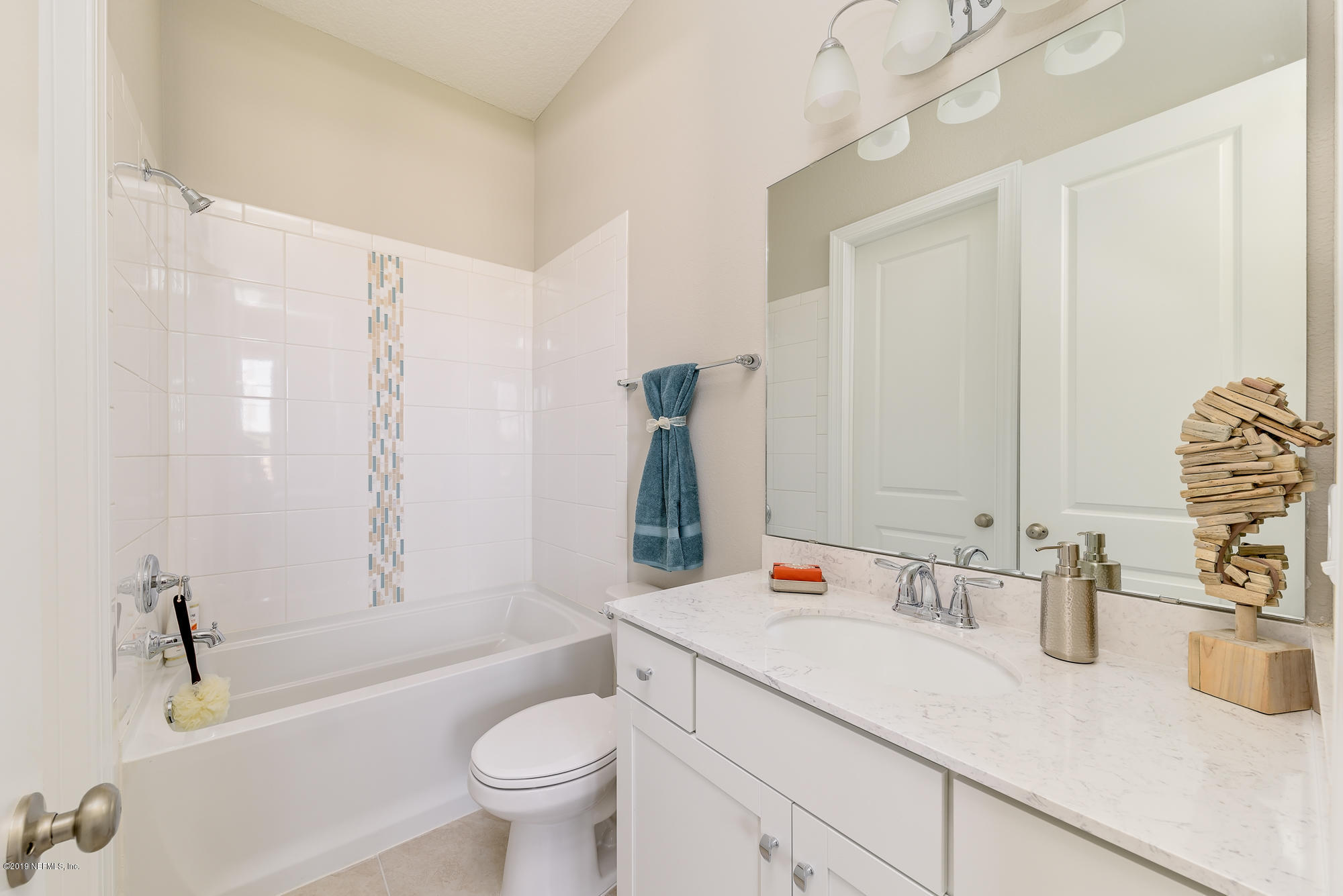 71 Lansing Court St. Augustine, FL 32092 - Photo 13 of 49 a bathroom with a granite countertop sink toilet and shower