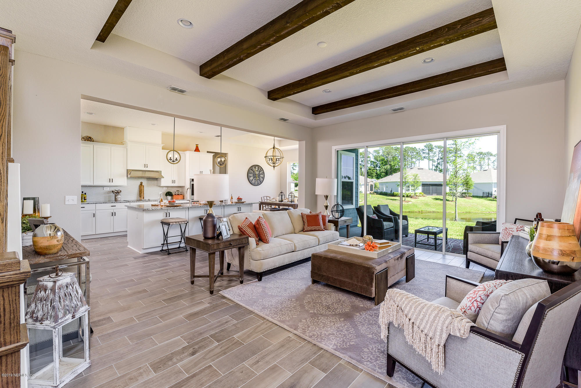 71 Lansing Court St. Augustine, FL 32092 - Photo 14 of 49 a living room with furniture and three large windows