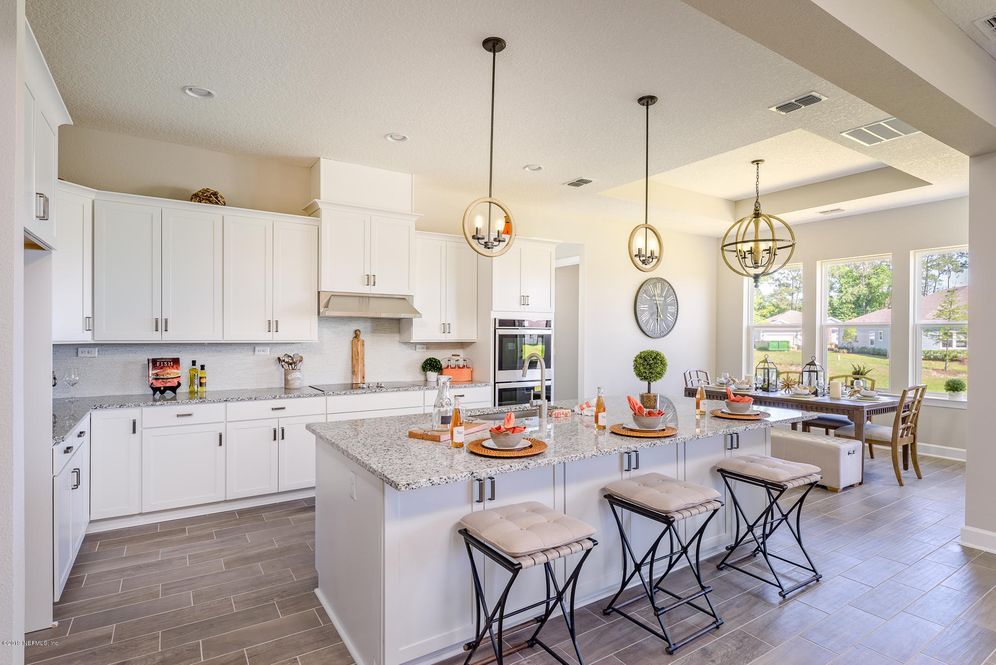 71 Lansing Court St. Augustine, FL 32092 - Photo 17 of 49 a open kitchen with stainless steel appliances kitchen island granite countertop a stove a sink and cabinets