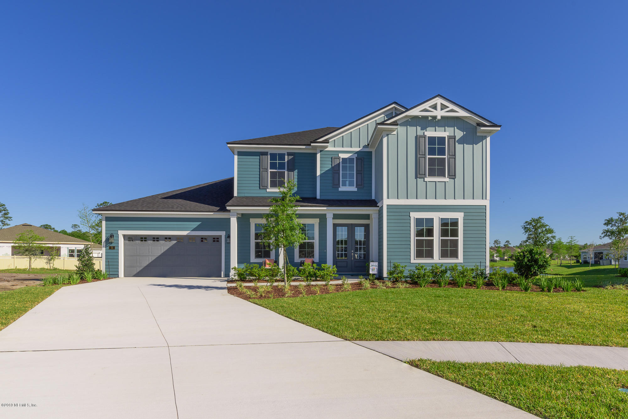 71 Lansing Court St. Augustine, FL 32092 - Photo 2 of 49 a front view of a house with a yard