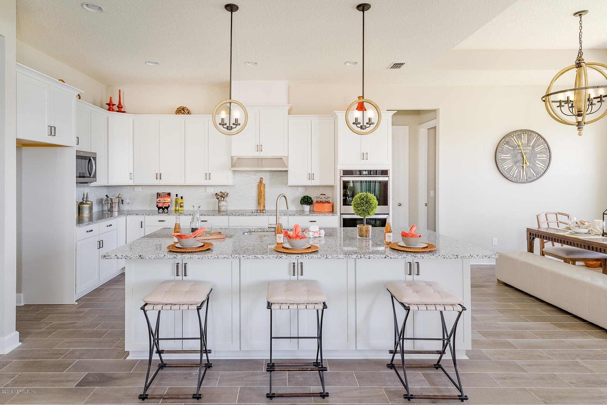 71 Lansing Court St. Augustine, FL 32092 - Photo 26 of 49 a view of dining table and chairs in a kitchen