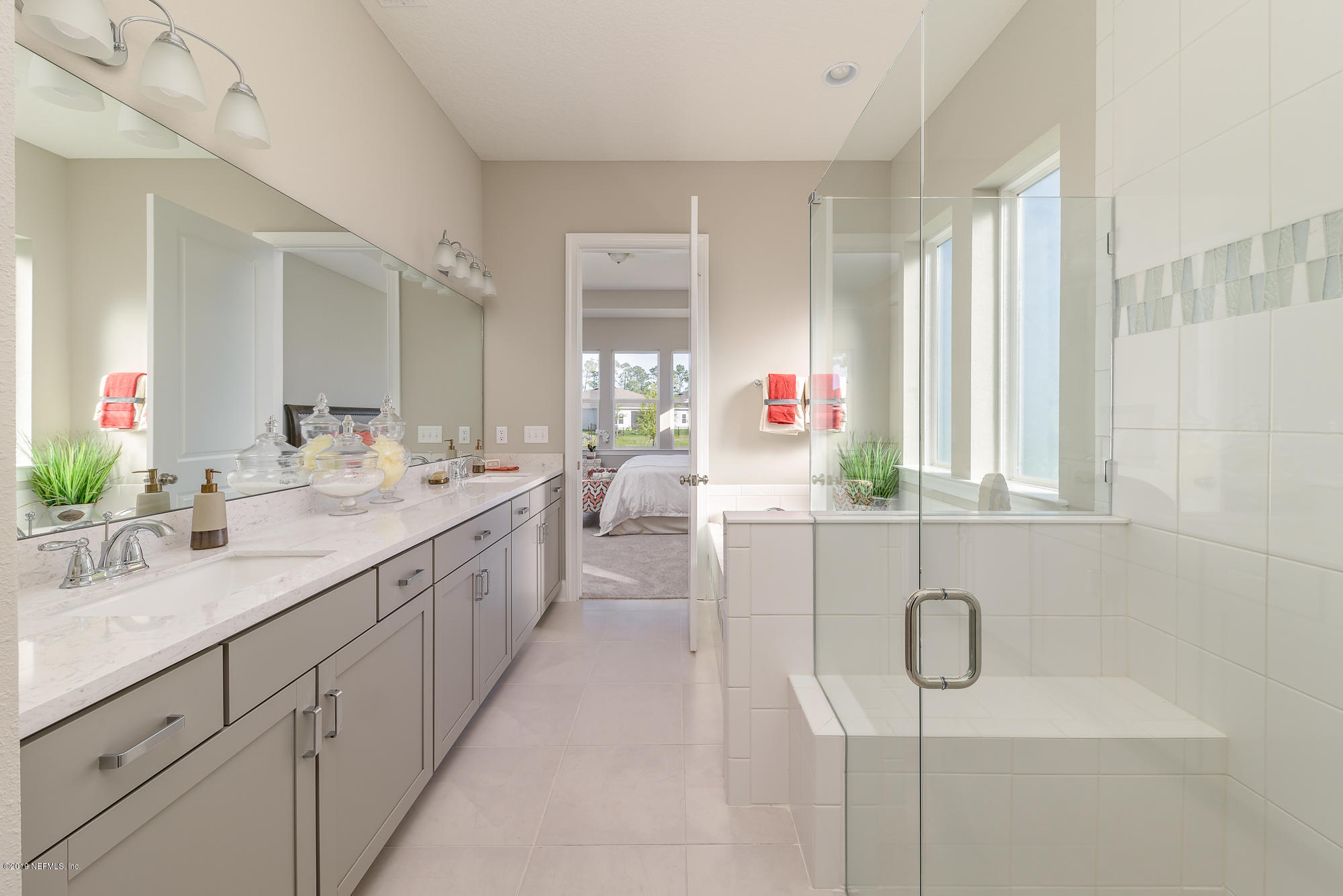 71 Lansing Court St. Augustine, FL 32092 - Photo 32 of 49 a bathroom with a double vanity sink mirror and shower