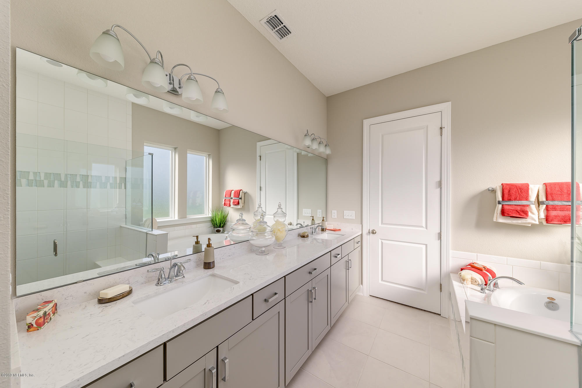 71 Lansing Court St. Augustine, FL 32092 - Photo 33 of 49 a bathroom with a sink double vanity and a shower