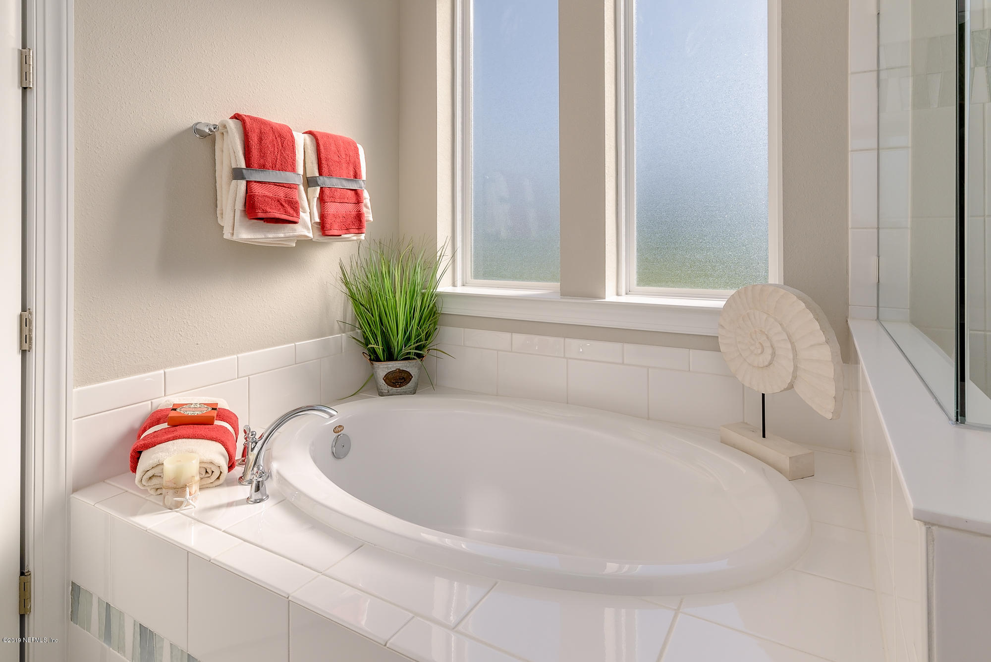 71 Lansing Court St. Augustine, FL 32092 - Photo 34 of 49 a white bath tub sitting next to a window