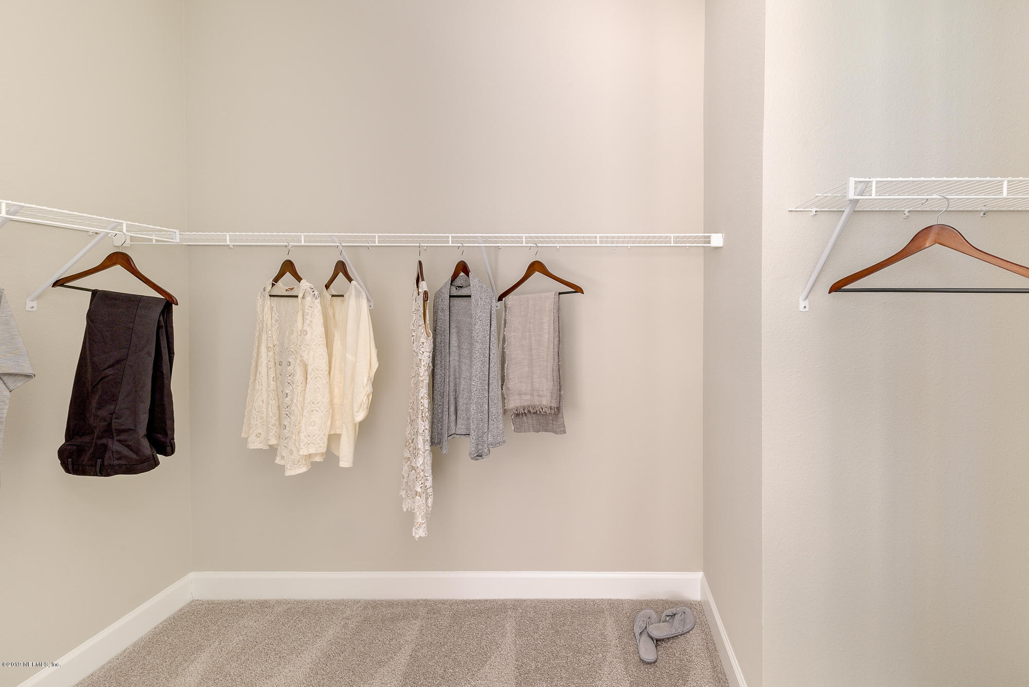 71 Lansing Court St. Augustine, FL 32092 - Photo 35 of 49 a view of walk in closet with clothes and shoes