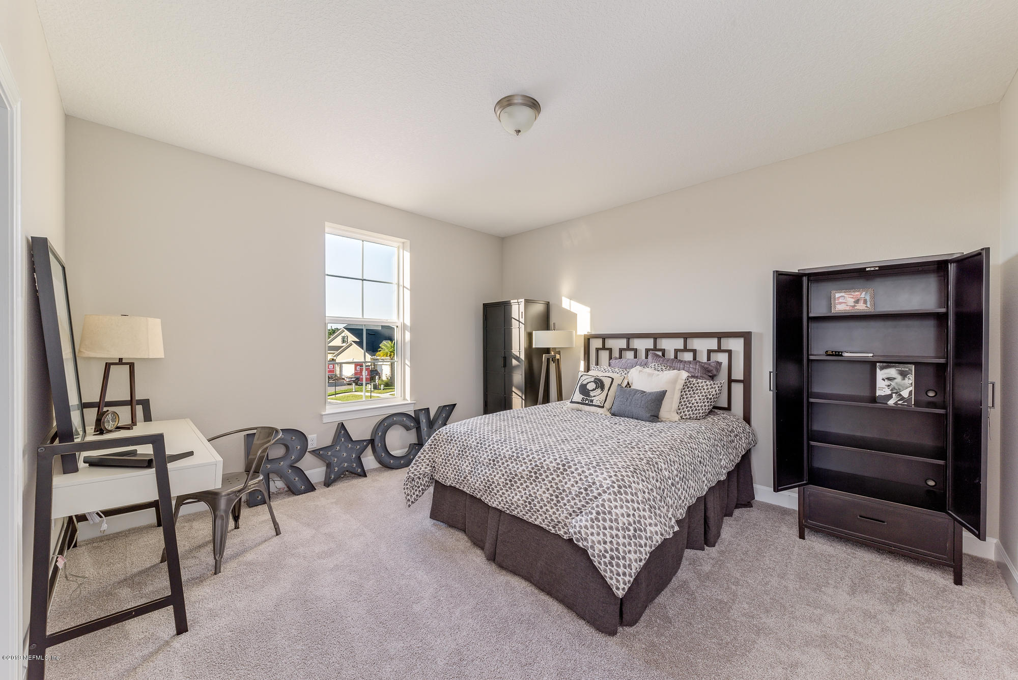 71 Lansing Court St. Augustine, FL 32092 - Photo 44 of 49 a bedroom with a bed and furniture