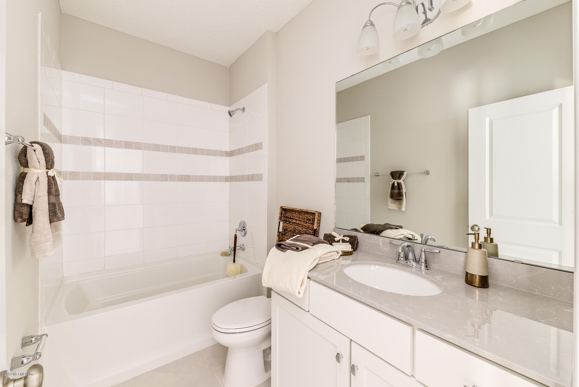 71 Lansing Court St. Augustine, FL 32092 - Photo 45 of 49 a bathroom with a granite countertop sink toilet and shower