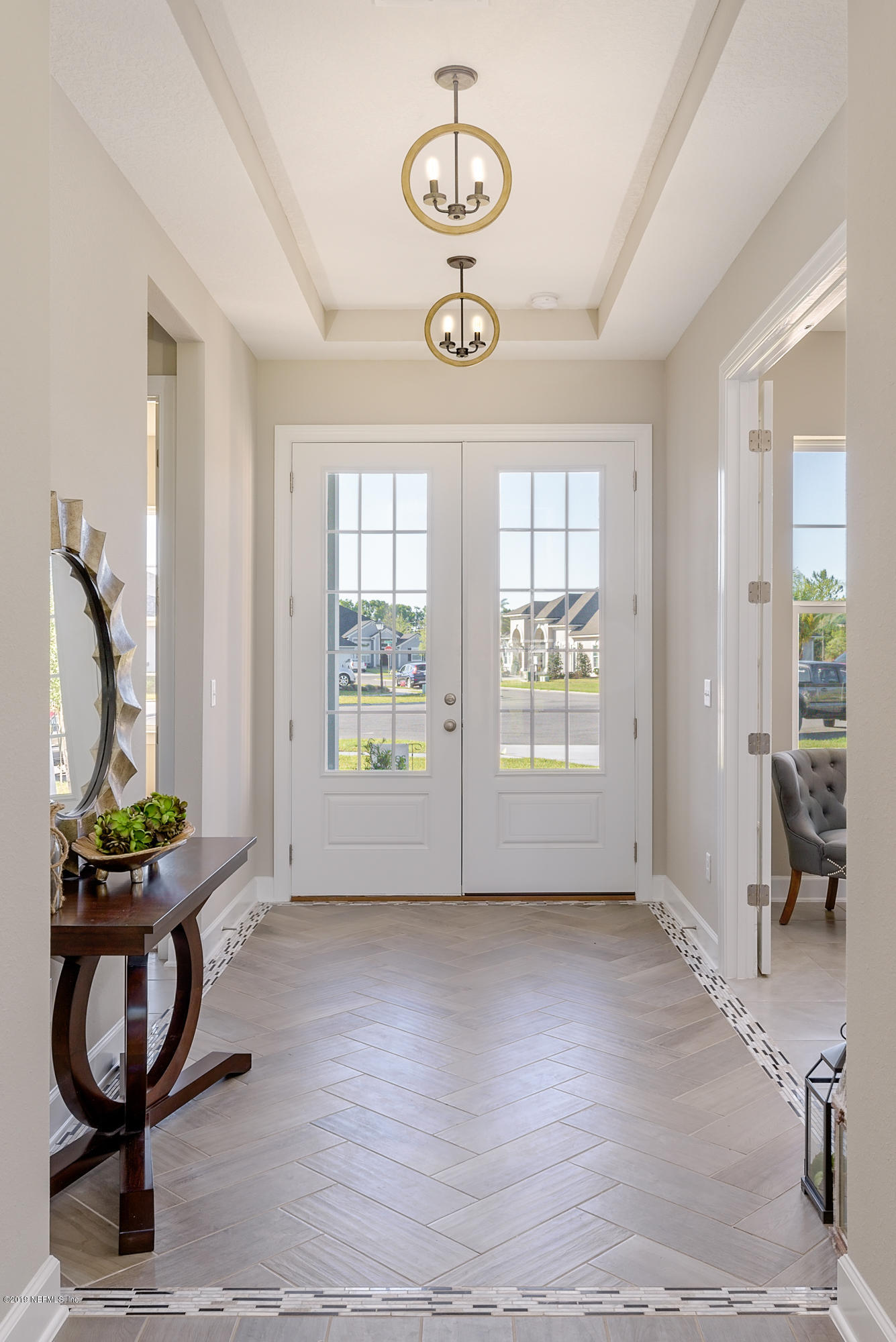 71 Lansing Court St. Augustine, FL 32092 - Photo 8 of 49 a view of an entryway with wooden floor