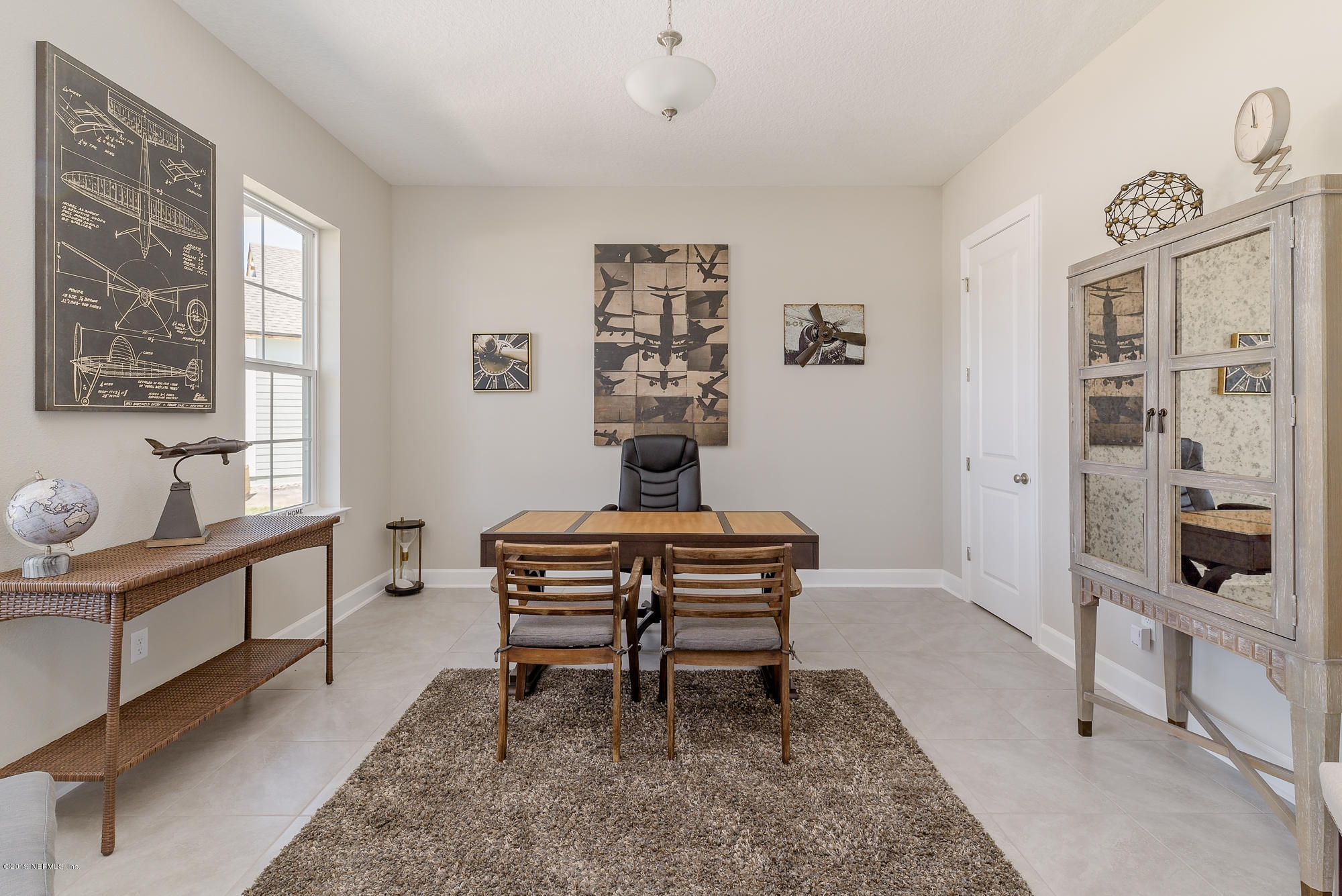 71 Lansing Court St. Augustine, FL 32092 - Photo 9 of 49 a living room with furniture a rug and a window