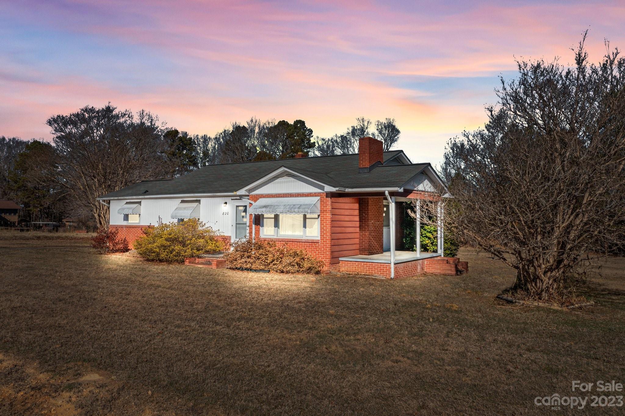 820 Thompson Road Salisbury, NC 28147 - Photo 1 of 48 a front view of a house with a yard and garage