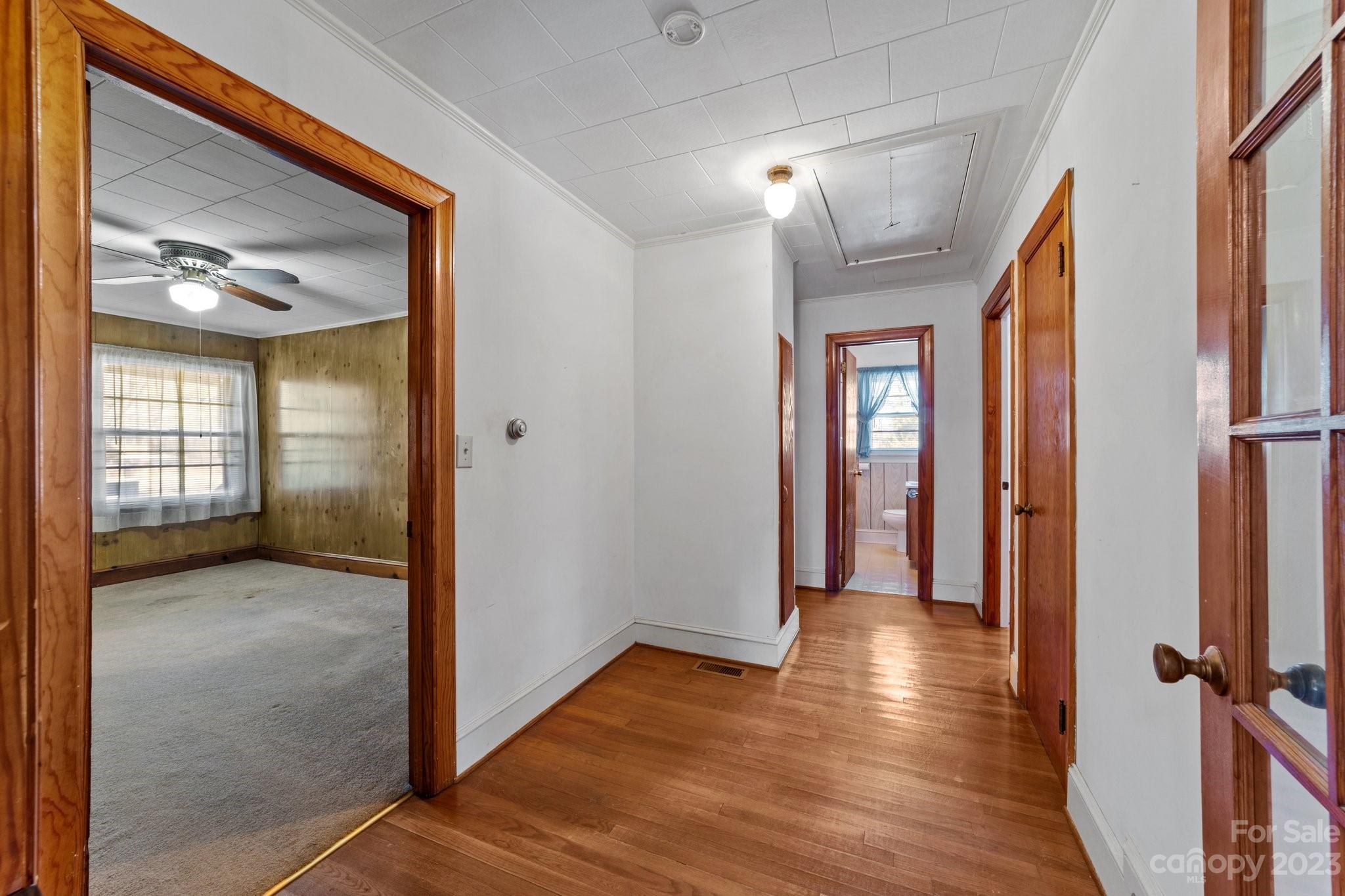 820 Thompson Road Salisbury, NC 28147 - Photo 11 of 48 a view of hallway with livingroom and wooden floor