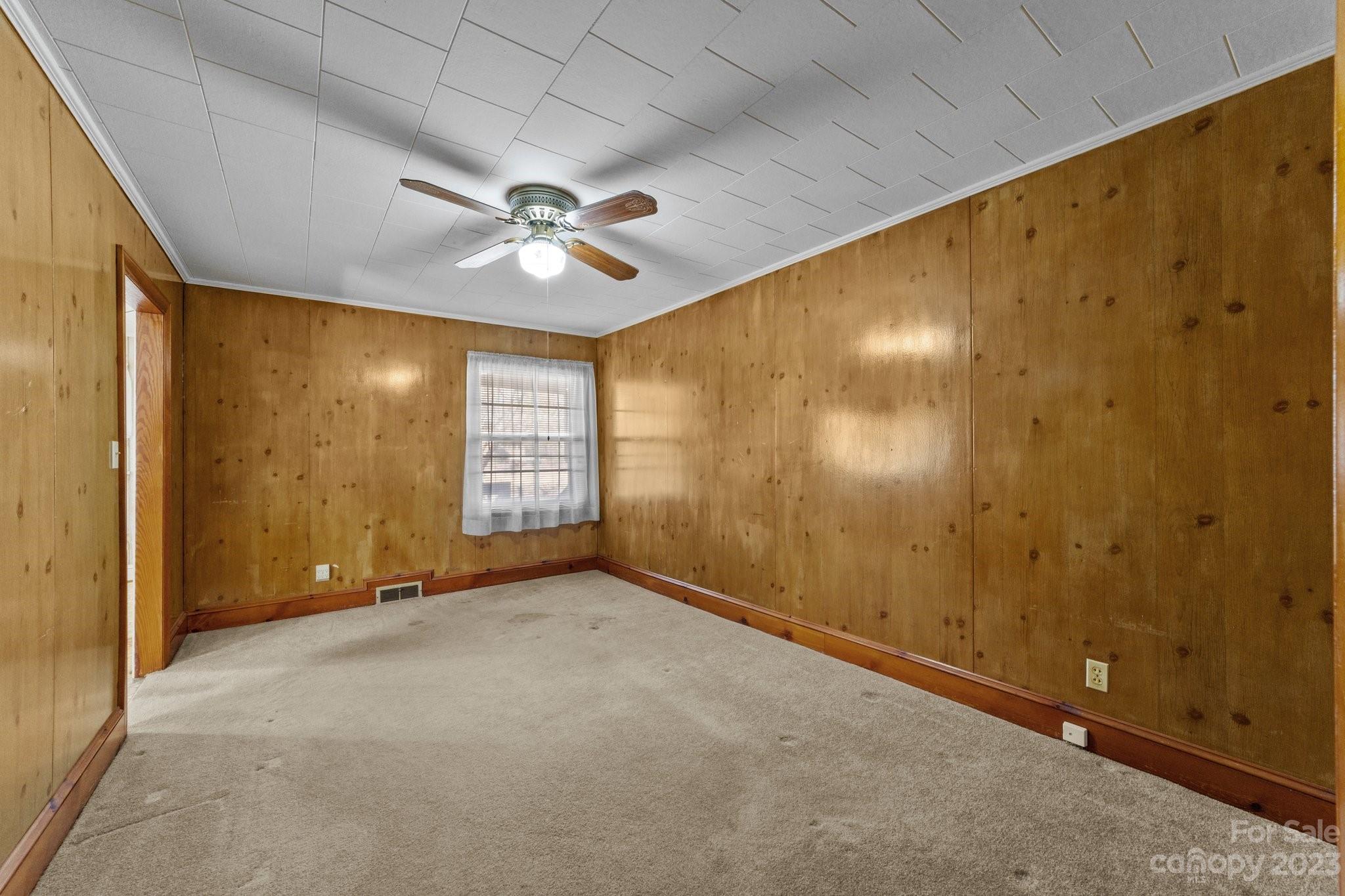 820 Thompson Road Salisbury, NC 28147 - Photo 12 of 48 an empty room with windows and fan