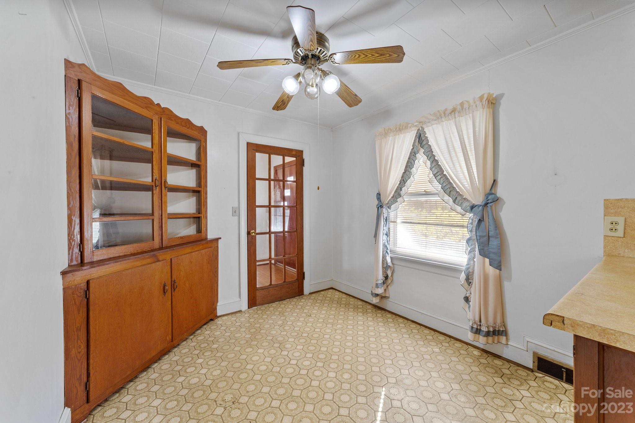 820 Thompson Road Salisbury, NC 28147 - Photo 13 of 48 an empty room with windows and cabinet