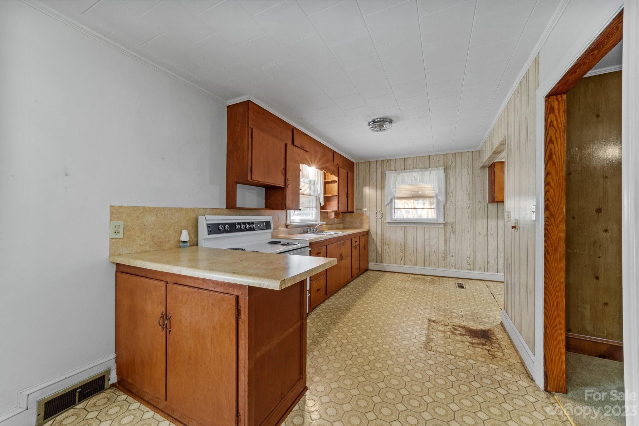 820 Thompson Road Salisbury, NC 28147 - Photo 15 of 48 a kitchen with a sink stove and cabinets