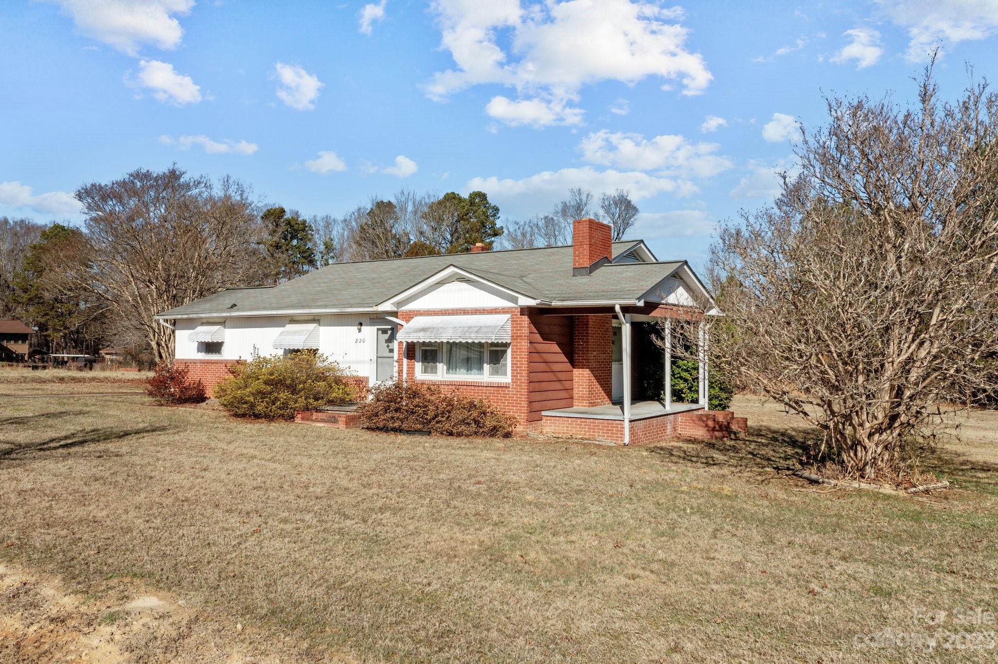 820 Thompson Road Salisbury, NC 28147 - Photo 32 of 48 a front view of a house with a yard and garage