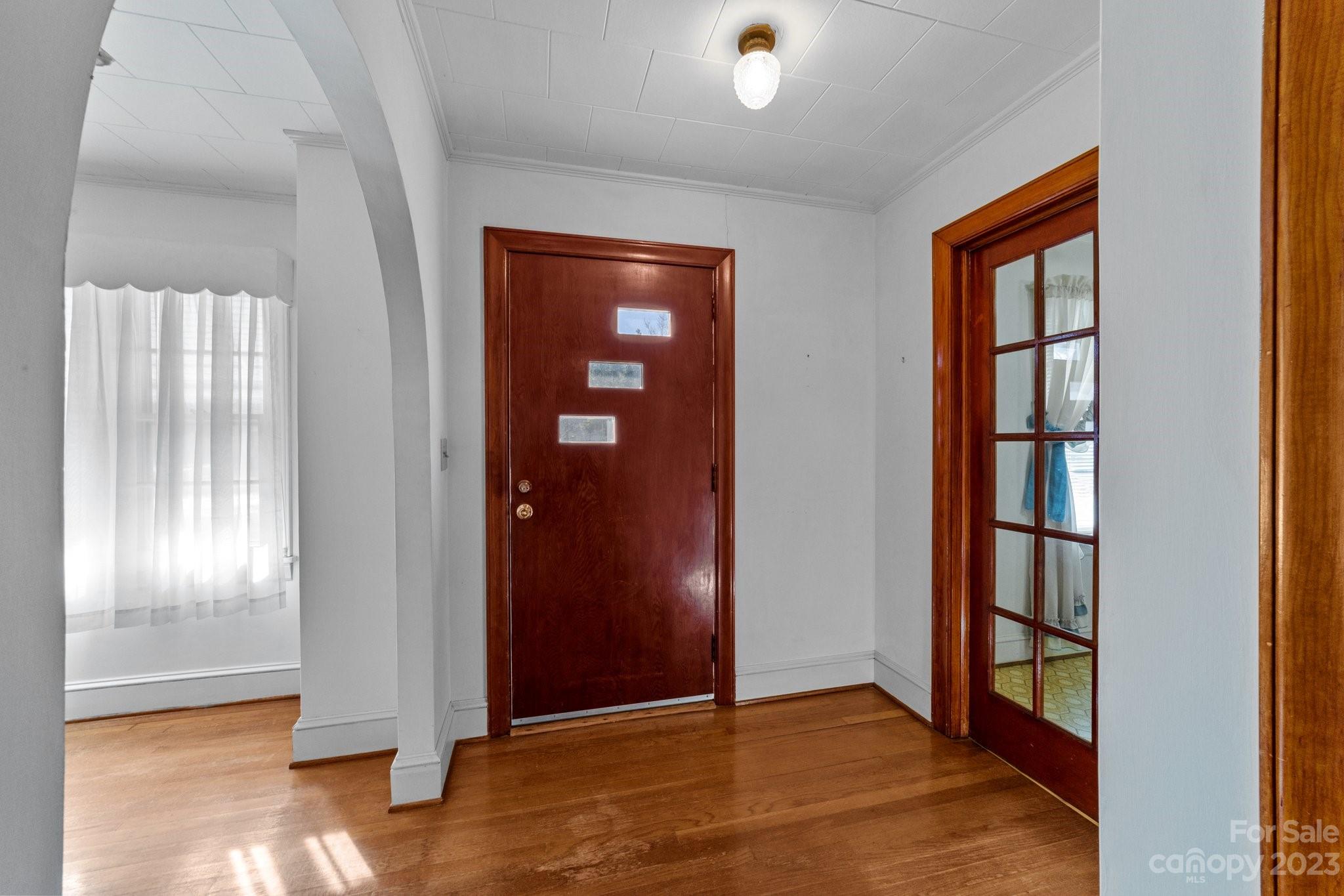 820 Thompson Road Salisbury, NC 28147 - Photo 8 of 48 an empty room with windows & wooden floor