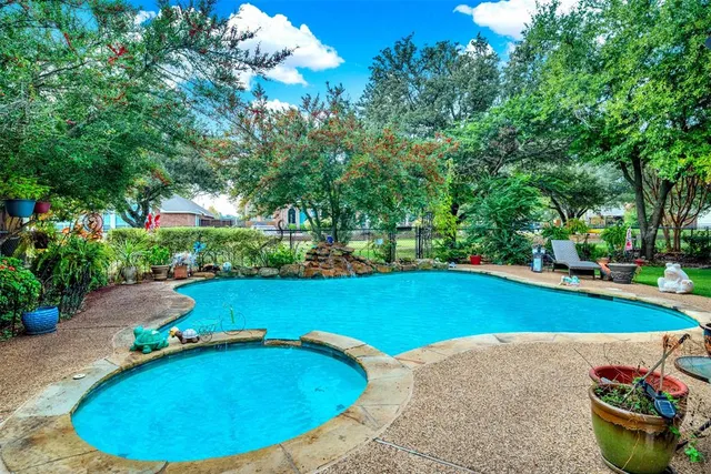 a view of a swimming pool and lounge chair