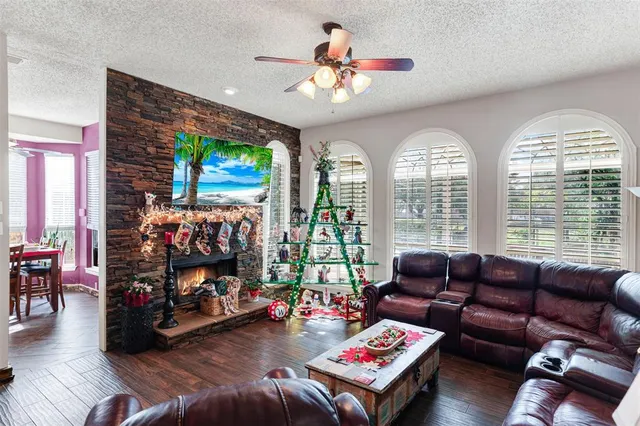 a living room with furniture window and wooden floor