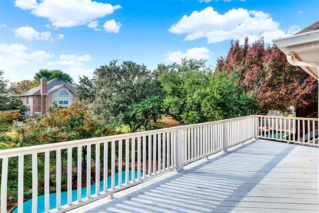 a view of a hallway and a livingroom with furniture