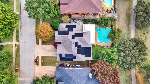 an aerial view of a house with a garden