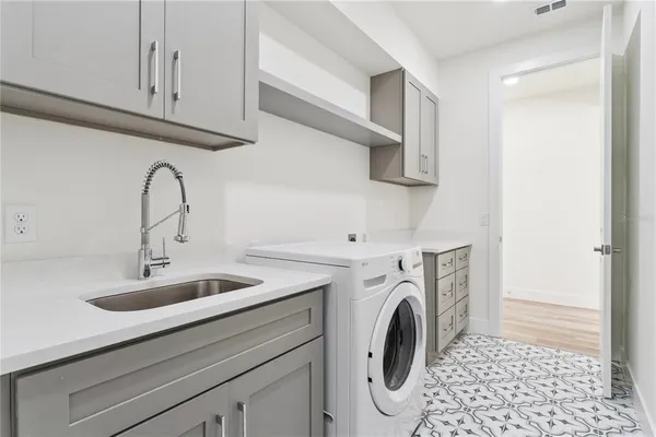 a view of livingroom with washer and dryer