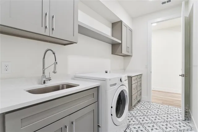 a view of livingroom with washer and dryer