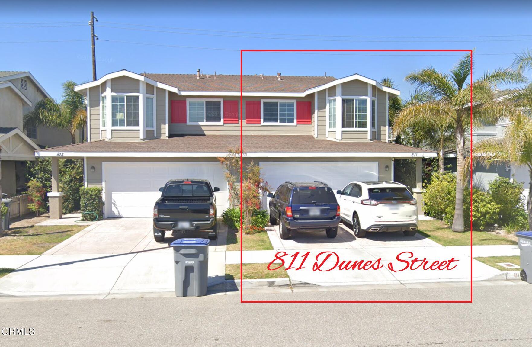 a front view of a house with a view of a house