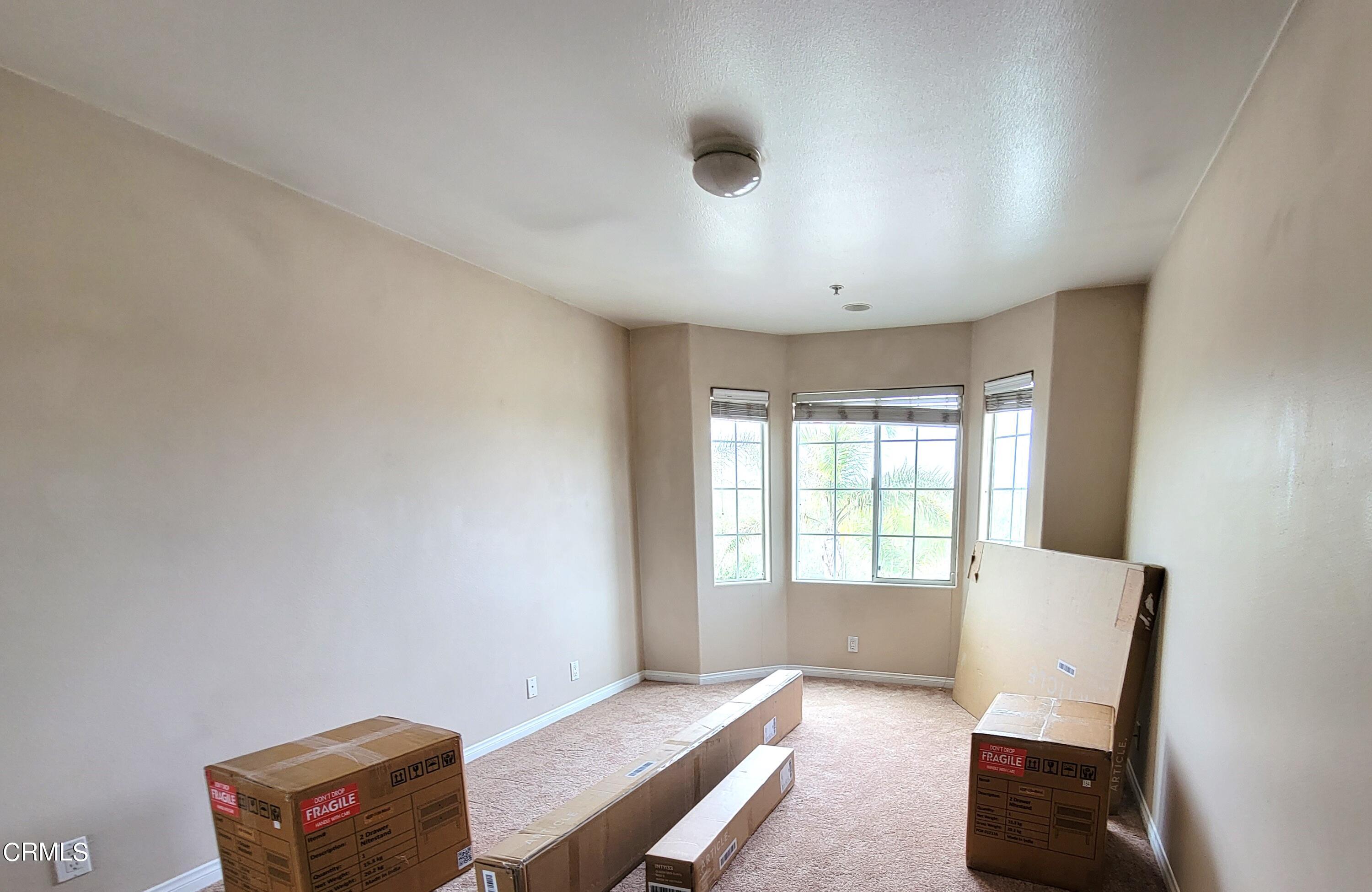 811 Dunes Street Oxnard, CA 93035 - Photo 6 of 10 a living room with furniture and a window
