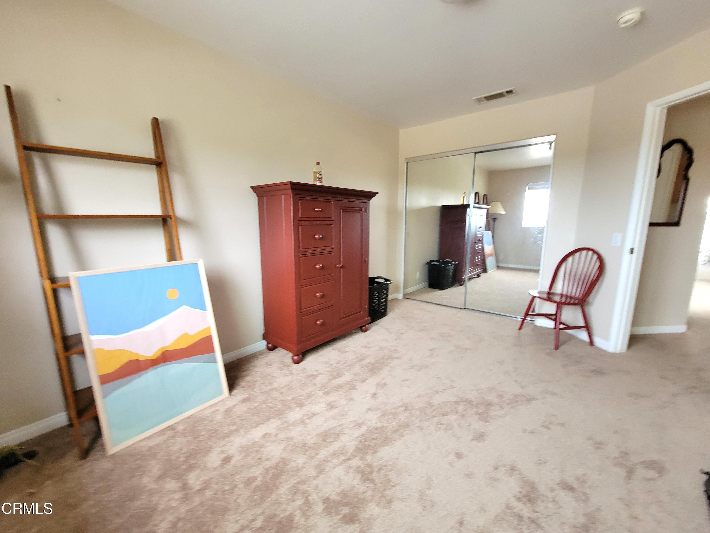 811 Dunes Street Oxnard, CA 93035 - Photo 7 of 10 a bedroom with furniture and a dresser