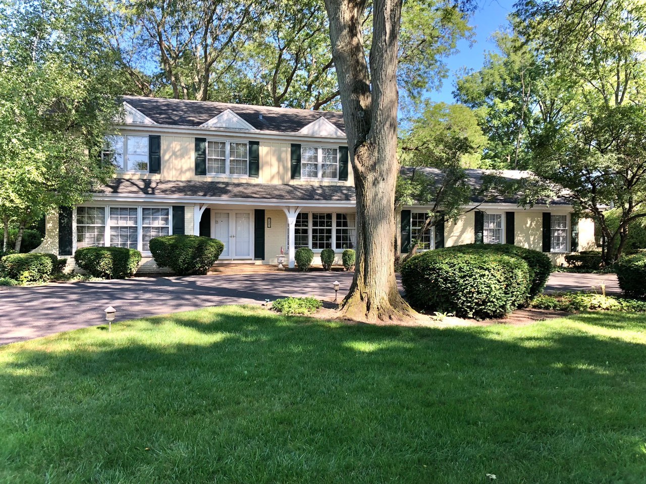 1721 Wagner Road Glenview, IL 60025 - Photo 1 of 17 a view of a house with a yard table and chairs