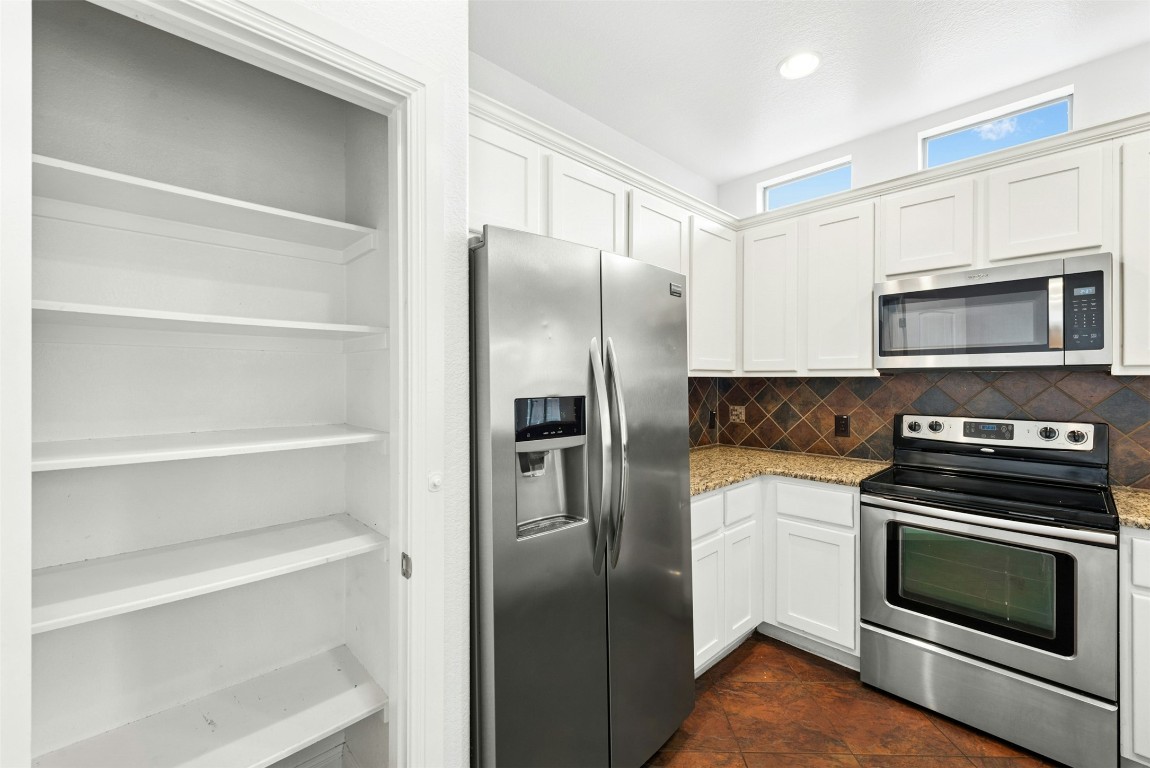 430 Old Fitzhugh Road, Unit 2 Dripping Springs, TX 78620 - Photo 14 of 28 a kitchen with a refrigerator stove and microwave