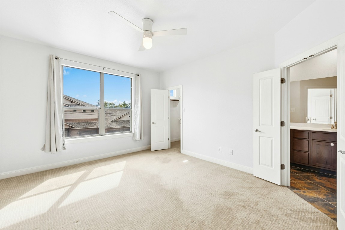 430 Old Fitzhugh Road, Unit 2 Dripping Springs, TX 78620 - Photo 19 of 28 a view of an empty room with a window