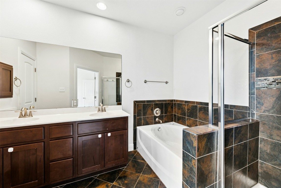 430 Old Fitzhugh Road, Unit 2 Dripping Springs, TX 78620 - Photo 20 of 28 a bathroom with a sink and mirror