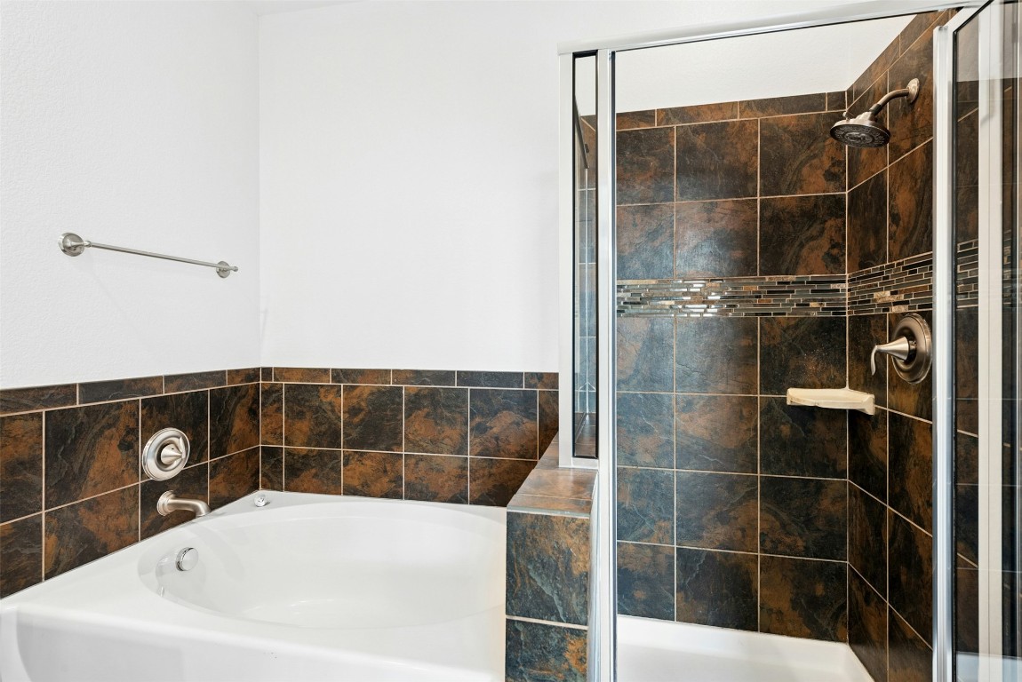 430 Old Fitzhugh Road, Unit 2 Dripping Springs, TX 78620 - Photo 21 of 28 a bathroom with a bathtub