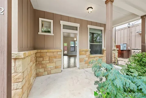 a front view of a house with a outdoor space