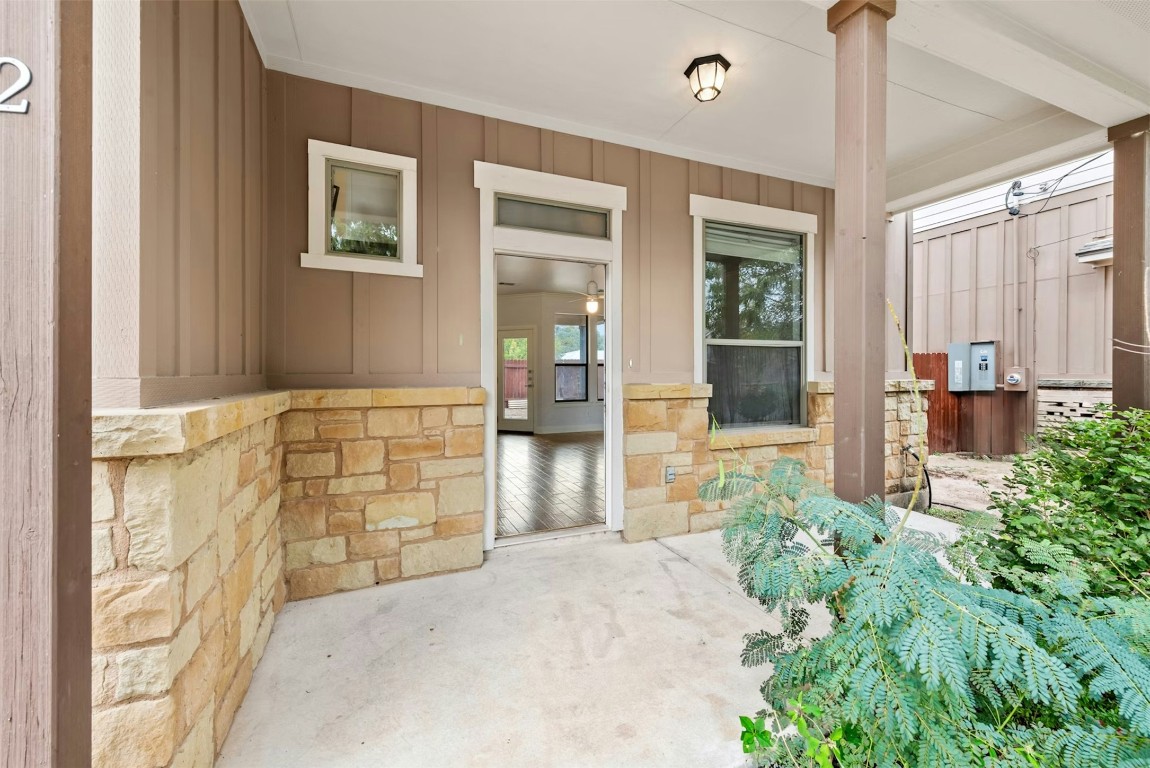 430 Old Fitzhugh Road, Unit 2 Dripping Springs, TX 78620 - Photo 4 of 28 a front view of a house with a outdoor space