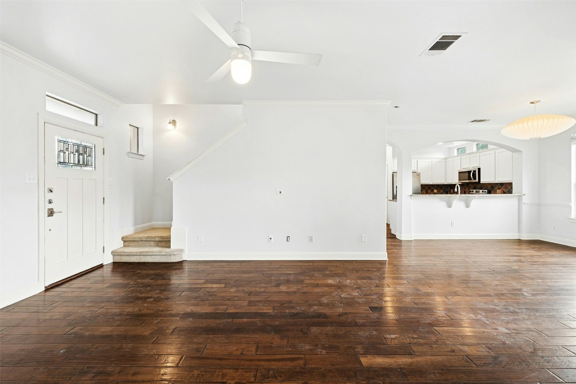 430 Old Fitzhugh Road, Unit 2 Dripping Springs, TX 78620 - Photo 5 of 28 a view of a kitchen with wooden floor and a sink