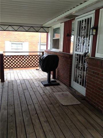 3050 Hillside Road Nashville, TN 37207 - Photo 13 of 17 Covered deck off back with entry stairs each side. Gas grill is connected to gas line and stays with home