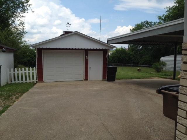 detached garage . Storage shelves side and back. Room on rightside for a deep freezer or extra fridge 