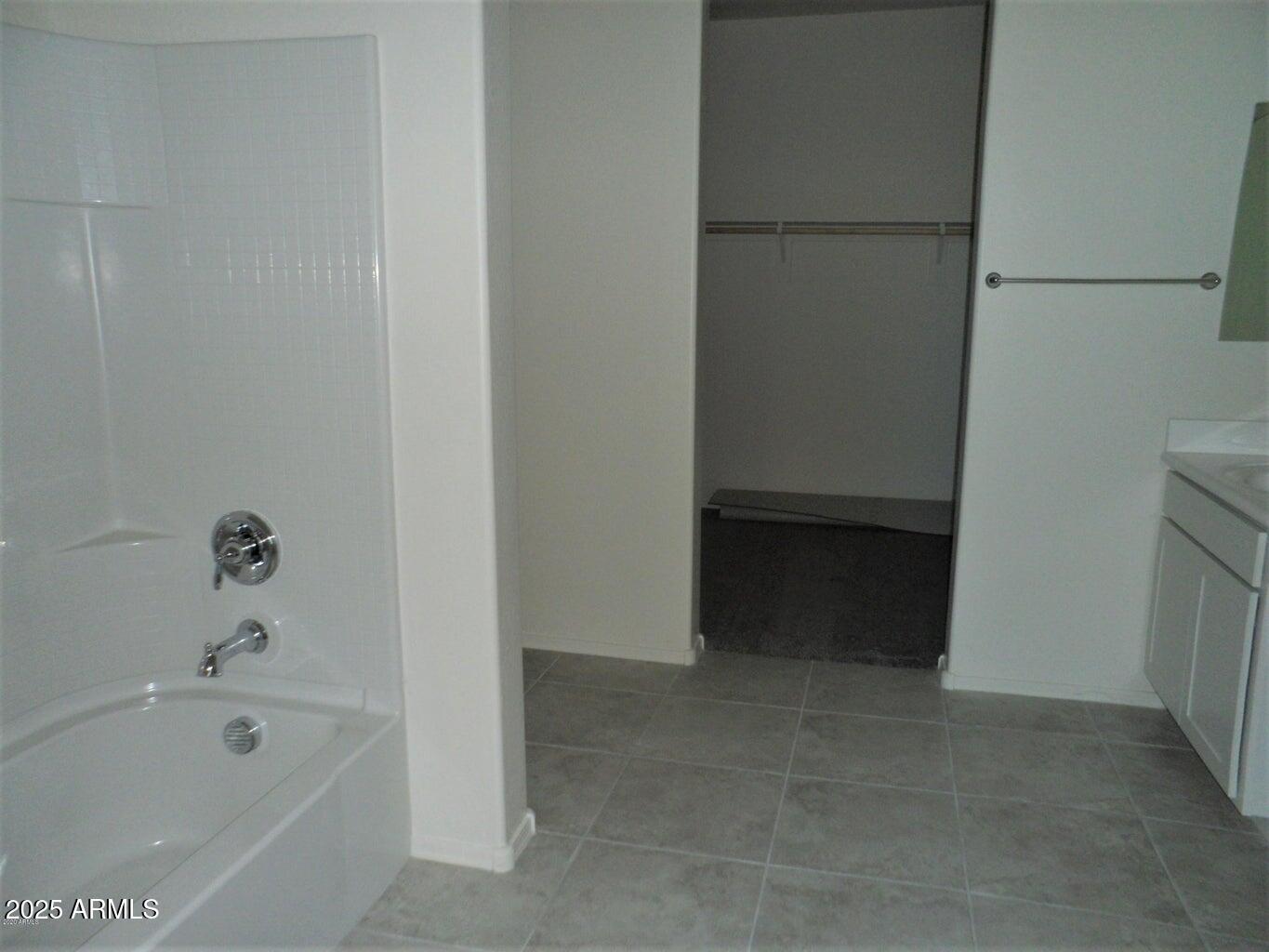 11618 West Boca Raton Road El Mirage, AZ 85335 - Photo 11 of 14 a bathroom with a bathtub