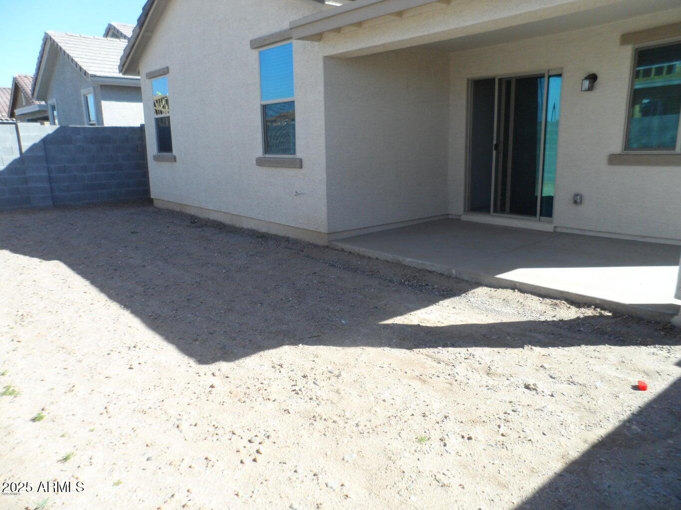 11618 West Boca Raton Road El Mirage, AZ 85335 - Photo 14 of 14 a view of wooden floor in front of a house