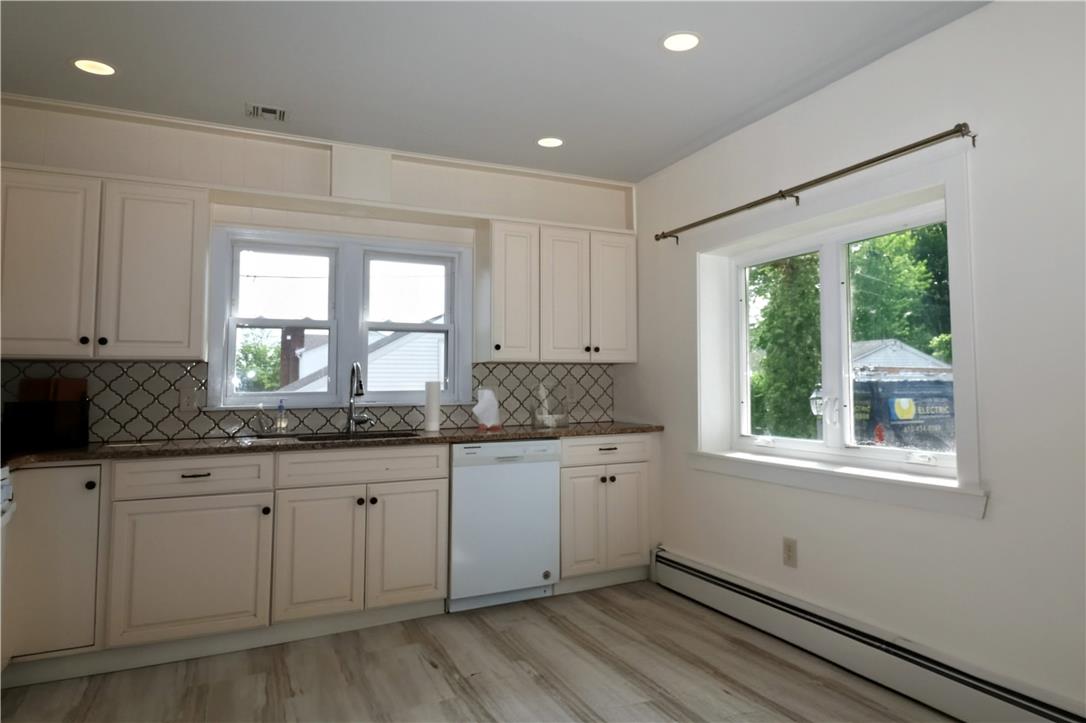 172 Harrison Street Emmaus, PA 18049 - Photo 5 of 30 A well-lit kitchen with ample counter space and natural light through large windows.