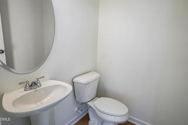 a kitchen with kitchen island granite countertop wooden cabinets and white appliances