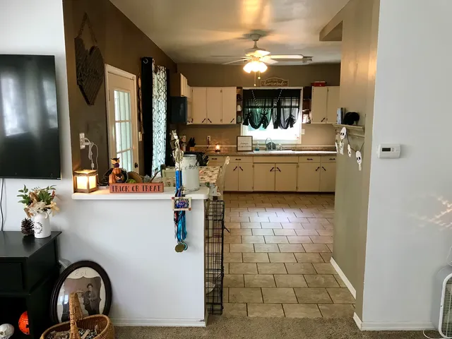 a kitchen with a stove a sink and a microwave