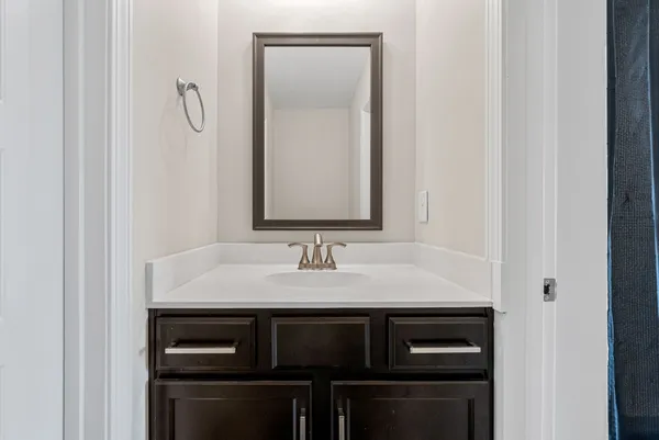 a close view of a sink and a mirror