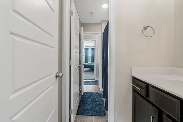 a view of a bathroom from a hallway