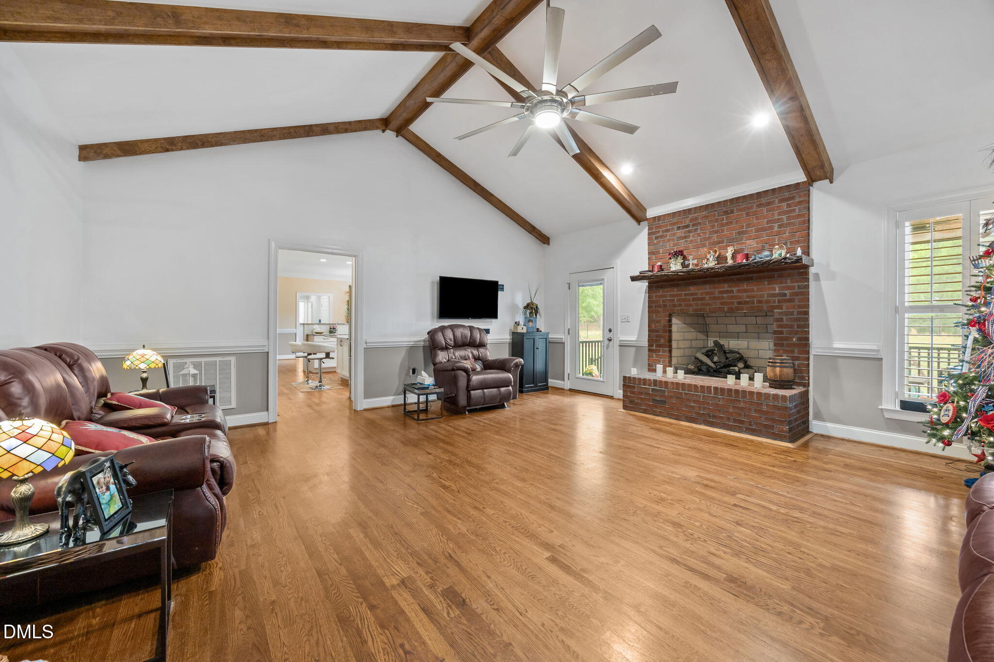 2880 Elevation Road Four Oaks, NC 27524 - Photo 13 of 51 a living room with furniture and a fireplace