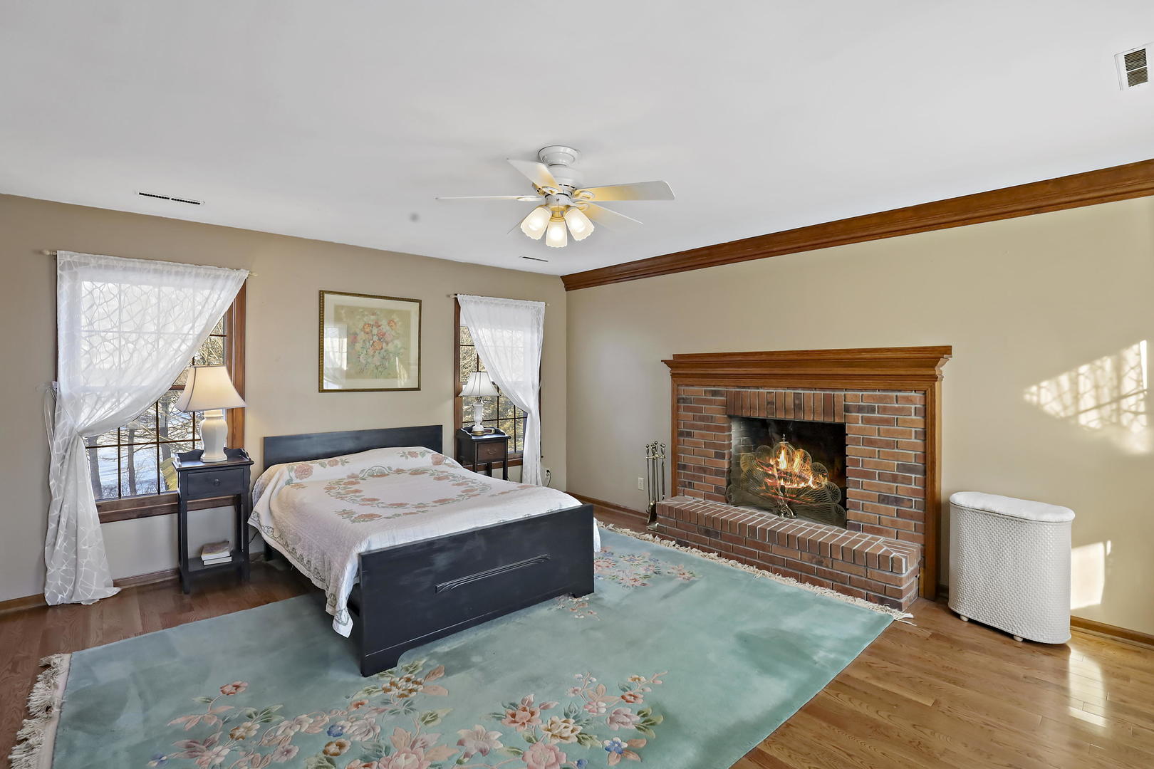 3N118 Howard Road Maple Park, IL 60151 - Photo 16 of 28 a living room with a bed and a fireplace