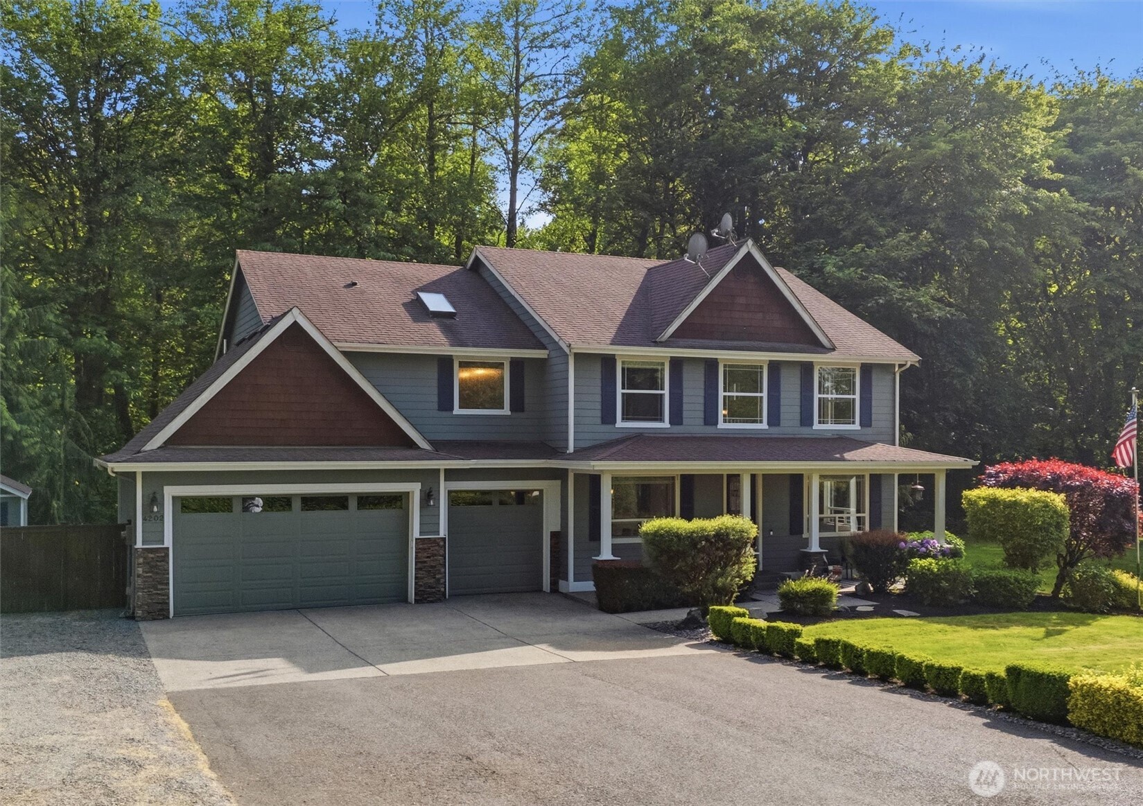 4202 Silvana Terrace Road Stanwood, WA 98292 - Photo 3 of 40 a front view of a house with a yard and garage